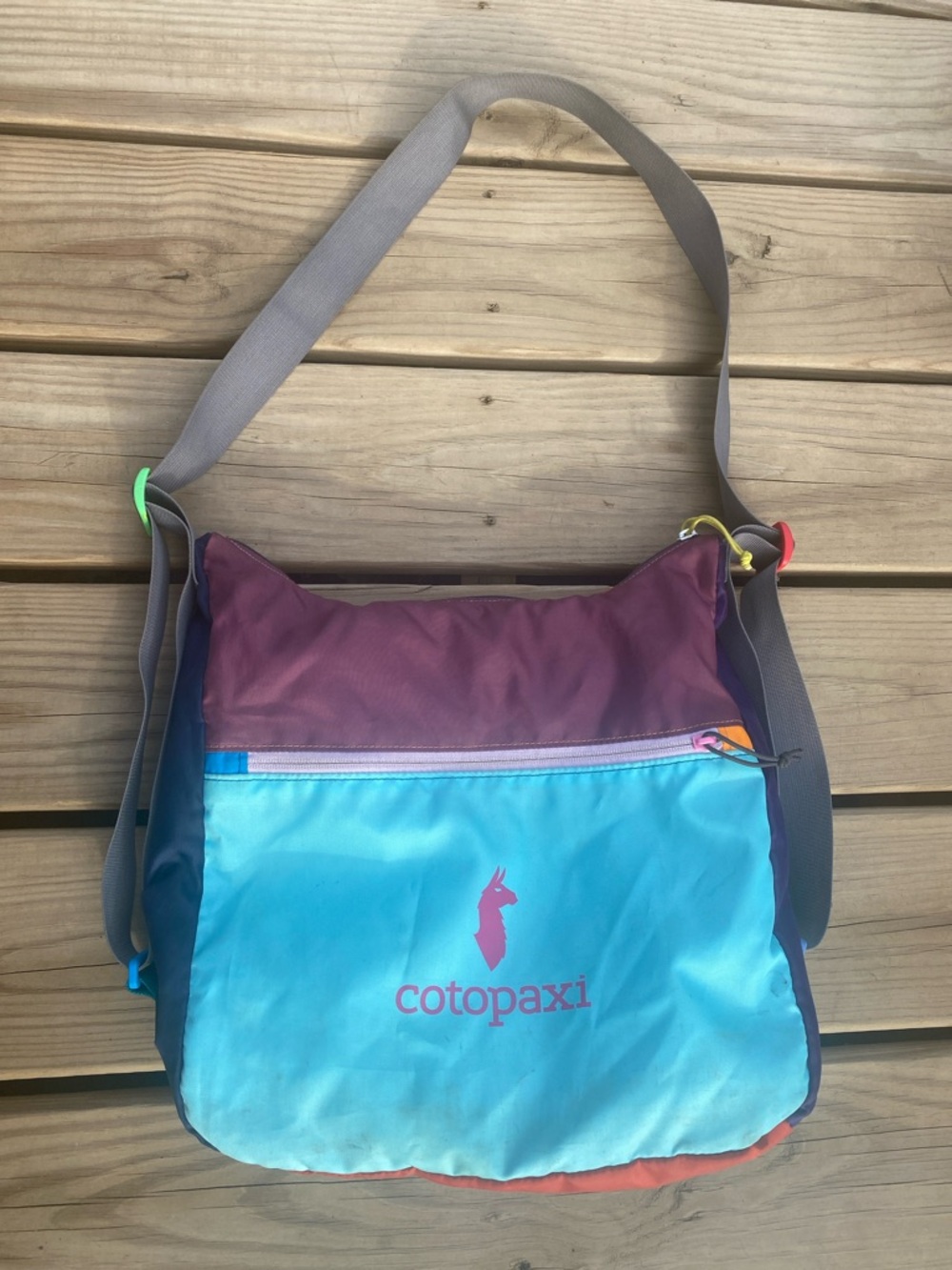 cotopaxi blue teal and maroon crossbody bag